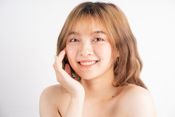 Beautiful xing woman with fresh skin smiling on background