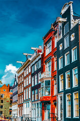 Fototapeta premium Amsterdam and typical houses with clear summer sky.Netherlands