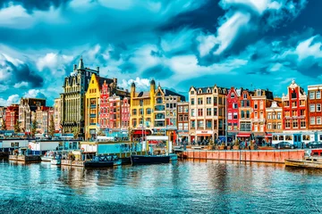 Fotobehang AMSTERDAM, NETHERLANDS - SEPTEMBER 15, 2015: Beautiful views of the streets, ancient buildings, people in Amsterdam - also call "Venice in the North". © BRIAN_KINNEY