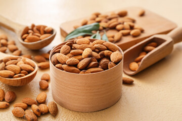 Composition with healthy almonds on color background