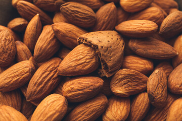 Fototapeta premium Heap of tasty almonds as background