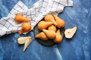 Fresh ripe pears on color  background