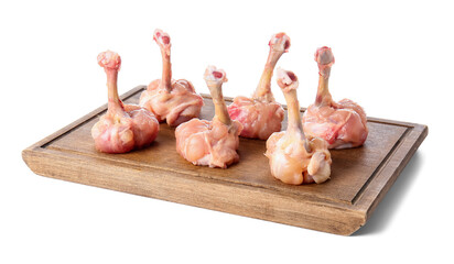 Board with raw chicken lollipops on white background