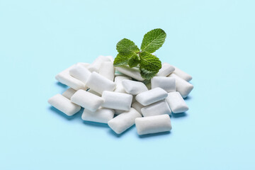 Mint chewing gums on color background