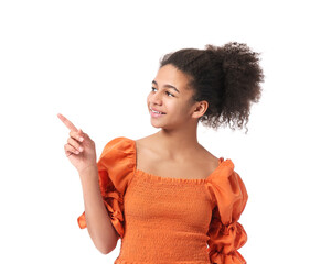 African-American teenage girl pointing at something on white background