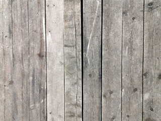 texture of old gray-brown wooden boards with cracks and rusty nails