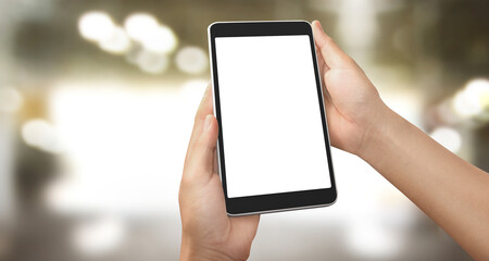 Hands holding a tablet touch computer gadget