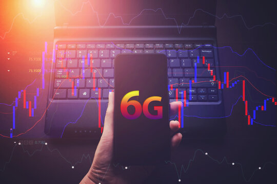 Female hands using smart phone with Virtual hologram 6G and finance digital line, smart phone and notebook computer. Mock up. Working from home, 6G network wireless systems.