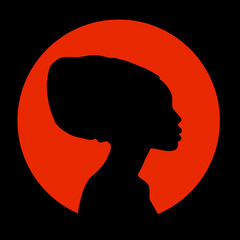 Silhouette of a beautiful African woman in a national turban. Black silhouette against the setting sun. Vector illustration.