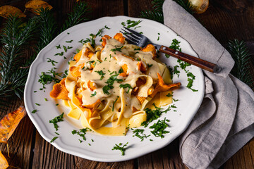 Tagliatelle with fresh chanterelles in a mushroom sauce