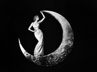 Young woman in evening elegant dress. Fashion Night dress. Beautiful young women posing on crescent moon on black background. Girls dream. - obrazy, fototapety, plakaty
