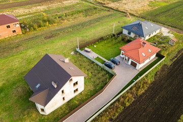 Aerial view of home roofs in residential rural neighborhood area.
