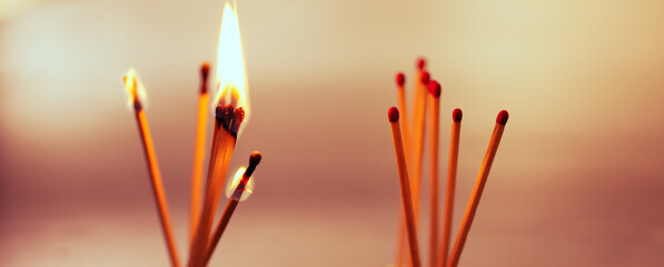 matches burning on disturbed red background