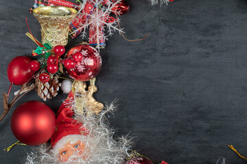 Christmas wreath with baubles and Santa on dark background