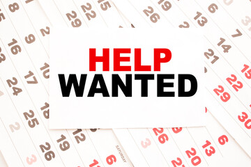 text HELP WANTED on a sheet from Notepad.a digital background. business concept . business and Finance.