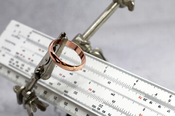 Gold ring and a measuring instrument, the value of jewelry, object
