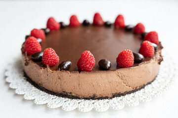 rich dark creamy chocolate cheesecake with strawberries 