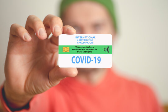 Coronavirus vaccination certificate or vaccine passport for travellers concept. COVID-19 immunity e-passport in id card for international travelling.