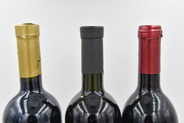selective focus at the center of three wine bottle necks