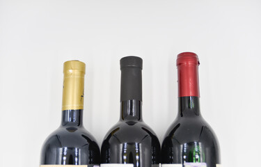 the top part of the wine bottles