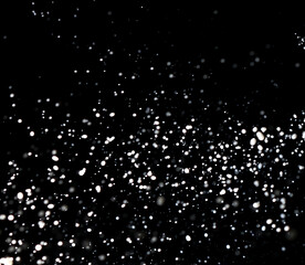 Splashes of white milk isolated on a black background.