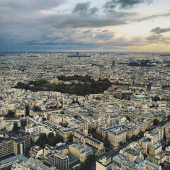 Panoramic view of Paris from the top floor of skyscraper, from above at sunset