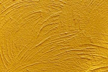 Cement wall painted yellow with rough lines texture and background seamless