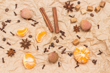 Fototapeta na wymiar Peeled tangerines and spices. Cinnamon sticks and star anise