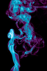 Purple and blue smoke isolated on black background. Abstraction