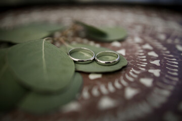 wedding gold rings on a ceremony table