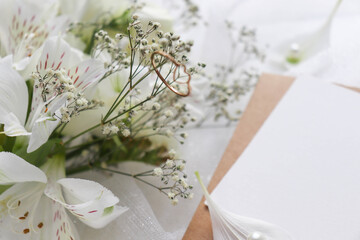 greeting card mockup. small bouquet of white flowers and space for text 