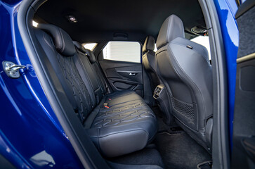 Row of passenger rear seats upholstered in black dry-cleaned fabric; pre-sale preparation