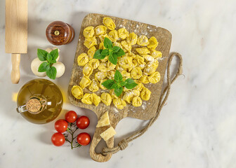 Homemade raw Italian stuffed pasta tortellini