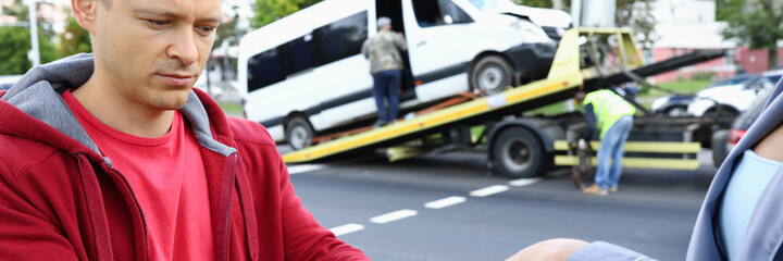 Insurance agent gives driver to sign documents after accident. Compensation for damage in car accident concept