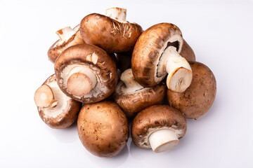 a pile of mushrooms on a white background