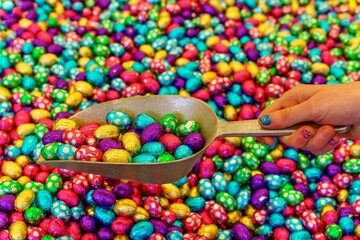 Chocolate eggs candy in a scoop