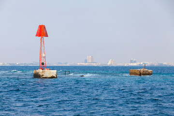 Framed red navigation tower with triangle top mark