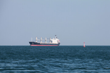 Bulk carrier, cargo ship goes on Red Sea on a sunny day