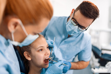 Dentist at work with patient
