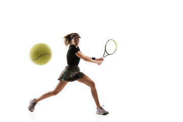 Fototapeta na wymiar Catching. Young caucasian professional sportswoman playing tennis isolated on white background. Training, practicing in motion, action. Power and energy. Movement, ad, sport, healthy lifestyle concept