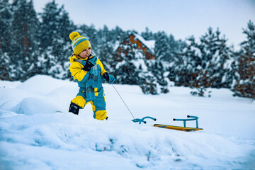 Little boy having fun in the snow