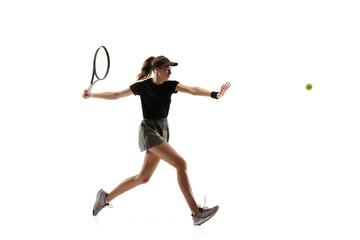 Youth. Young caucasian professional sportswoman playing tennis isolated on white background. Training, practicing in motion, action. Power and energy. Movement, ad, sport, healthy lifestyle concept.