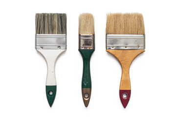 Three brushes for repairing and painting walls and ceilings on a white background