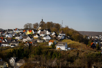 view of a church on a hill in the city of Warstein in the Sauerland area, Germany