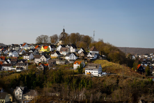 view of a church on a hill in the city of Warstein in the Sauerland area, Germany