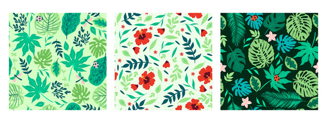 Set of seamless patterns with tropical leaves and flowers. Vector graphics.