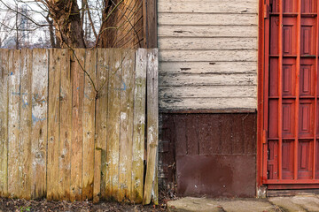 A fragment of an old wooden house and fence.