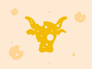 Yellow round cheese with holes in the shape of a cow's head