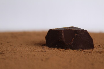 Chocolate bar pieces lie a stack of slides on each other day chocolate kind of side with space for text and copyspace