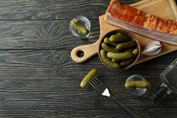 Vodka and tasty snacks on wooden table